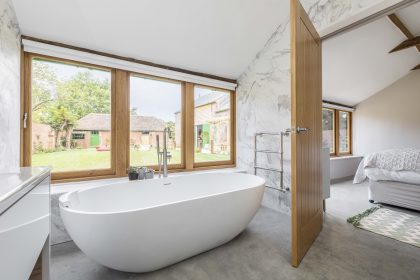 Minimalist garden design with an English garden twist for a holiday let farm complex, Eastry, Kent, UK, Mark Lane Designs, view of garden from minimalist bathroom