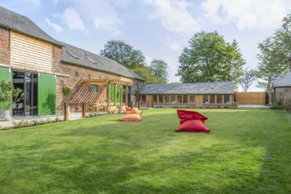 Minimalist garden design with an English garden twist for a holiday let farm complex, Eastry, Kent, UK, Mark Lane Designs, barn conversion, large lawn and bean bags