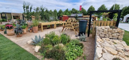 Photograph of the RHS-BBC Morning Live Budget-friendly Feature Garden from the front at RHS Hampton Court Palace Garden Festival 2023, designed by Mark Lane from Mark Lane Designs Ltd
